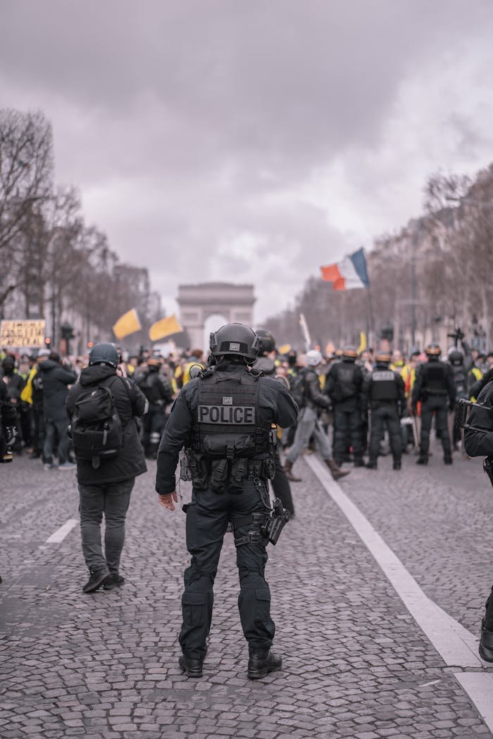 Demonstrators and police face off during a protest in Paris, near the Arc de Triomphe.